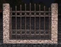 A Rounded stone high iron fence