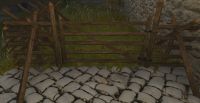 A Crude wooden rail fence gate