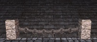 A Rounded stone chain fence